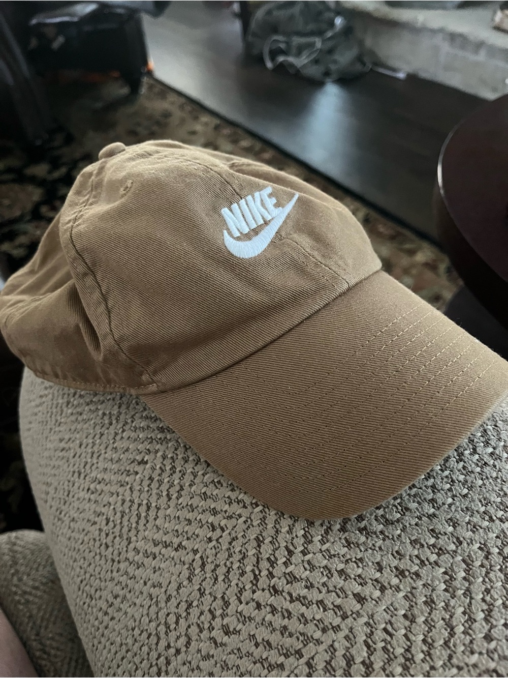 Tan Nike Club Unstructured Futura washed cap with white Nike swoosh.